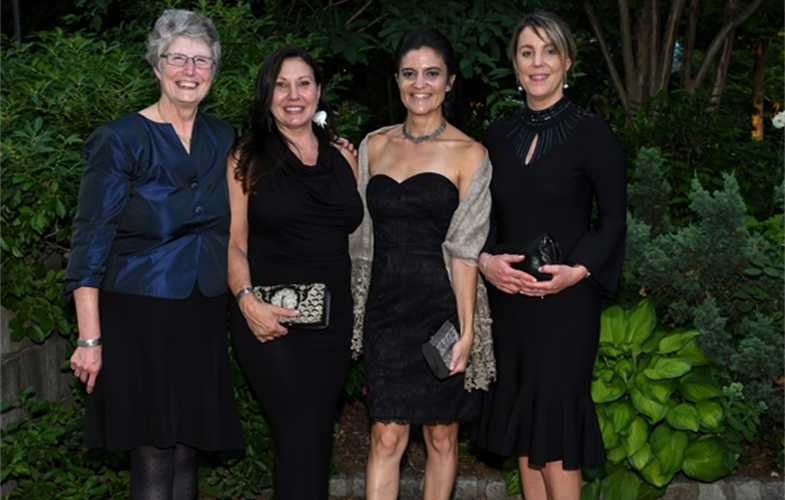 WCS colleagues Elizabeth Bennett, Kathleen LaMattina, Natalia Rossi, and Jessica Moody join other WCS Gala attendees to commemorate “Women in Conservation” at the Central Park Zoo. CREDIT: Megan Maher/Wildlife Conservation Society. 